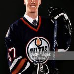 COLUMBUS, OH - JUNE 22:  21th overall pick Riley Nash of the Edmonton Oilers poses onstage with team personnel during the first round of the 2007 NHL Entry Draft at Nationwide Arena on June 22, 2007 in Columbus, Ohio.  (Photo by Gregory Shamus/Getty Images)